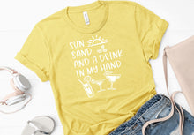 Load image into Gallery viewer, Sun sand and a drink in my hand (Bella + Canvas) T-Shirt
