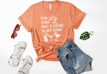 Load image into Gallery viewer, Sun sand and a drink in my hand (Bella + Canvas) T-Shirt
